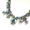 iridescent blue rhinestone necklace in white metal by Sherman from the 1950s