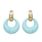 A pair of vintage hoop clip earrings with gold plating and multicolored resin hoops.