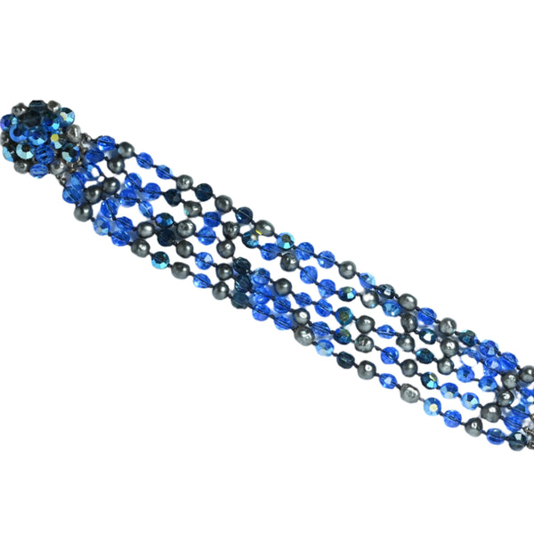 Multistrand beaded bracelet with blue and black beads on a white background