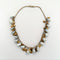 Necklace with gold and grey agate beads on a white background