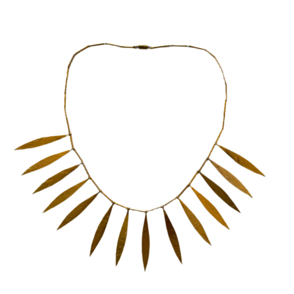 Gold decorative necklace on a white background