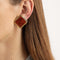 Gold plated brown swirl clip-on earrings model pic