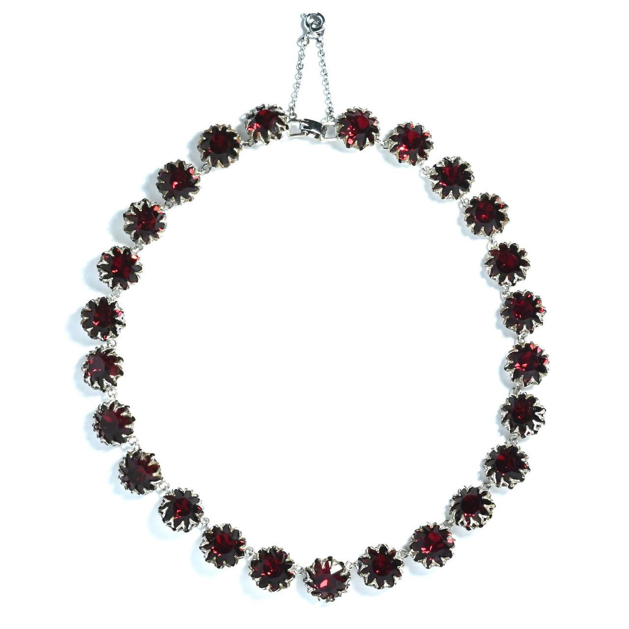 Red rhinestone necklace in a silver plated filagree setting vintage