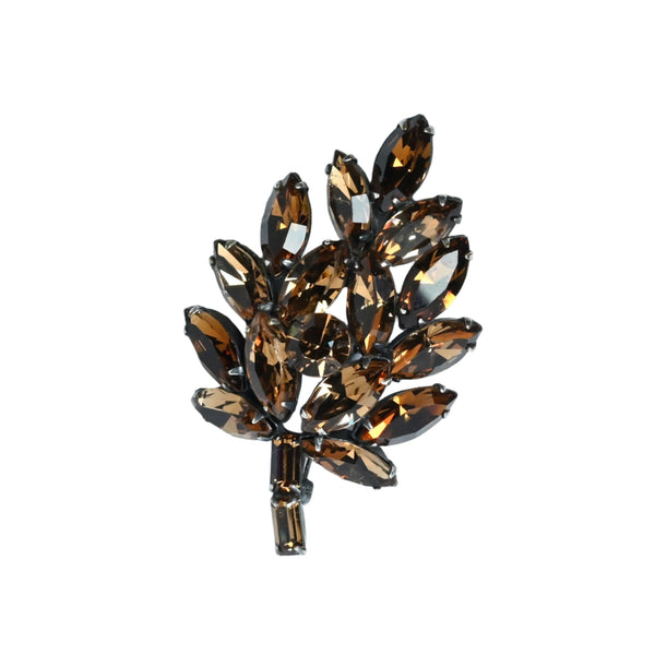 brown vintage rhinestone brooch on grey plate