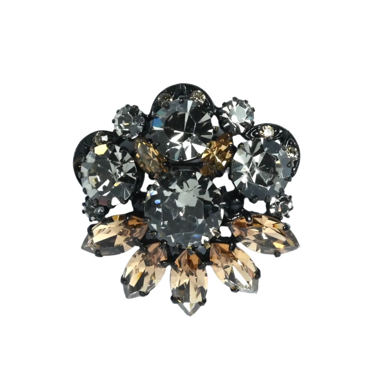 A vintage claw set brooch with mink brown navettes and grey large rhinestones on a white background