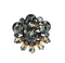 A vintage claw set brooch with mink brown navettes and grey large rhinestones on a white background