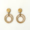 Pair of gold hoop earrings on a white background