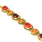 autumnal vintage bracelet by Joan Rivers that dates back to the 1990s. It has orange, brown and topaz glass stones that are set on gold plated metal