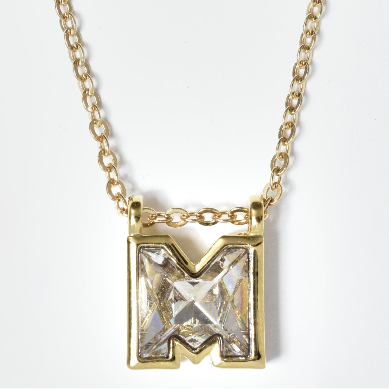 gold plated initial M pendant featuring Swarovski crystal