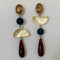 Pair of earrings with colorful beads on a white background