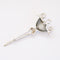 reverse of vintage chrome trifari brooch on white background