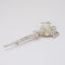 vintage chrome trifari brooch on white background