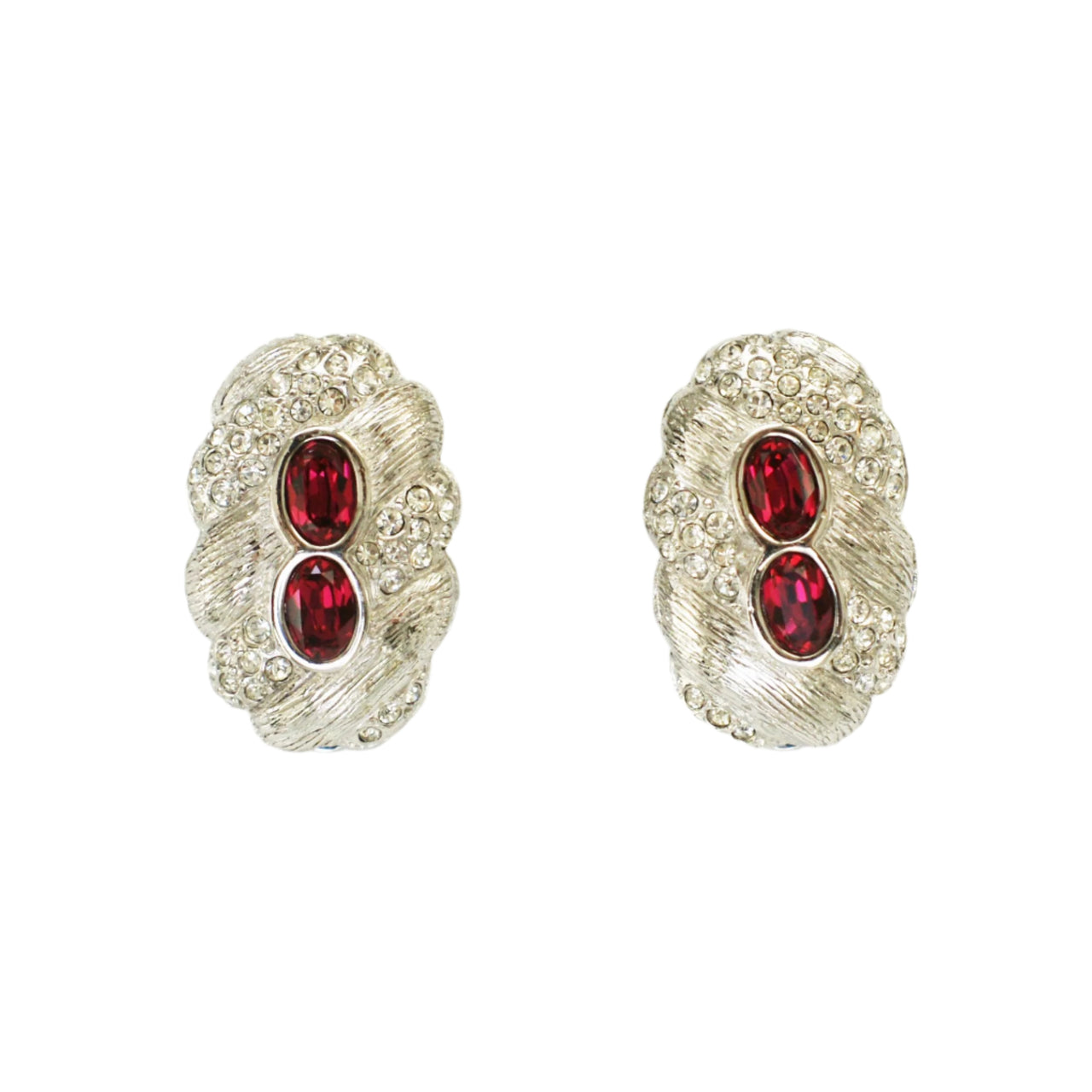 A pair of Attwood UK red clip-on earrings with central oval faceted rhinestones and clear Swarovski crystals, rhodium plated.