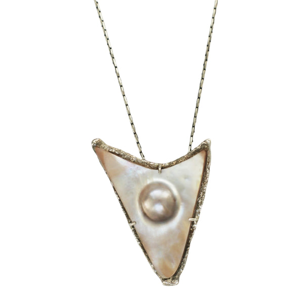A sterling silver pendant featuring a mother of pearl design in a delicate shade of pink, with a visible setting.
