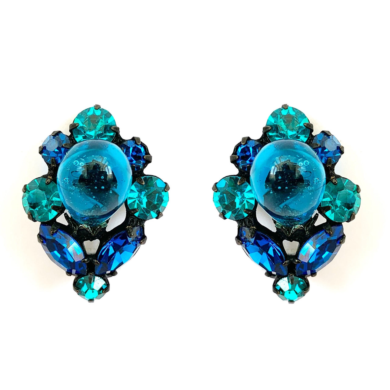 teal and blue vintage rhinestone clip on earrings on white background