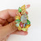 pastel rhinestones vintage brooch on white background