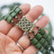 close up of the clasp of Triple row 1960s vintage beaded necklace in matt forest green