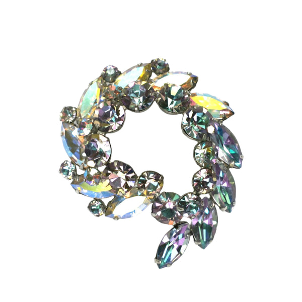 Multicolored gemstone brooch on a white background