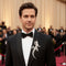 man wearing brooch dinner jacket