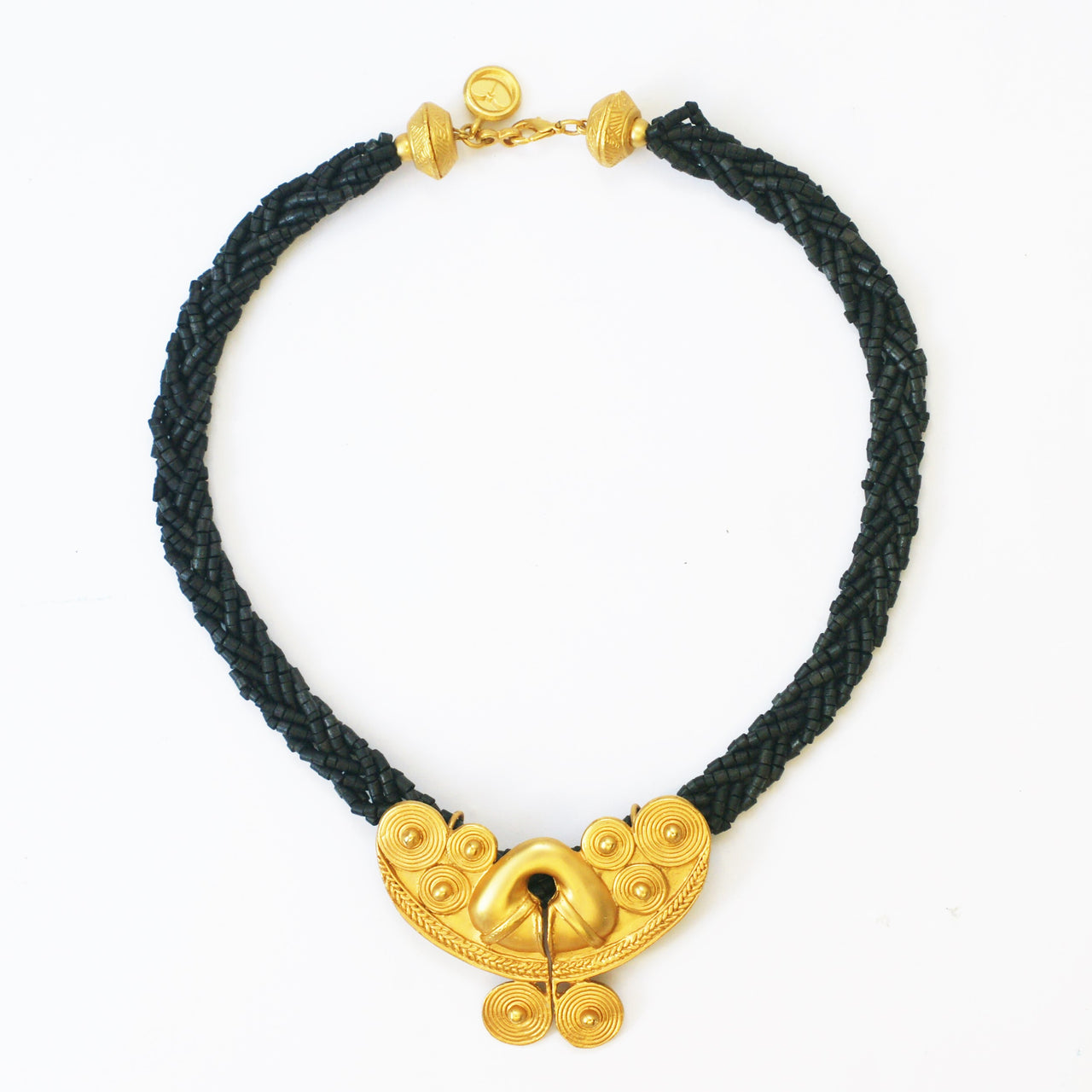 plaited black beads and matt gold plated front vintage necklace on white background