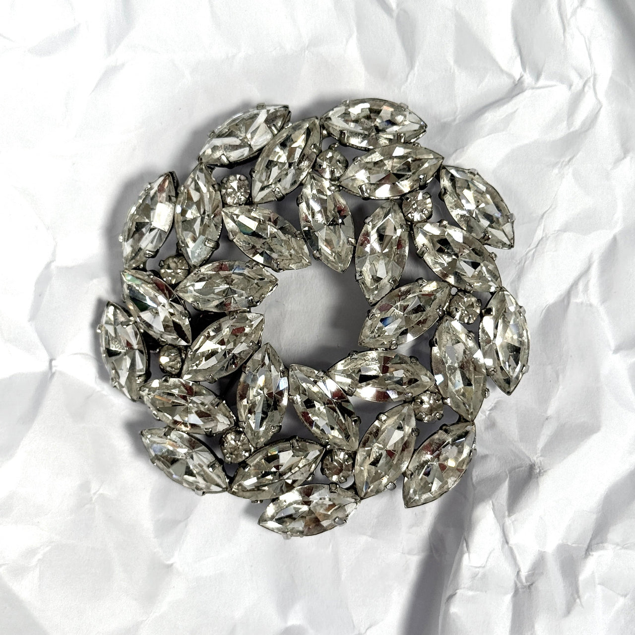 diamanté brooch on white background