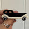 Black resin brooch in the shape of  a vintage car by Lea Stein