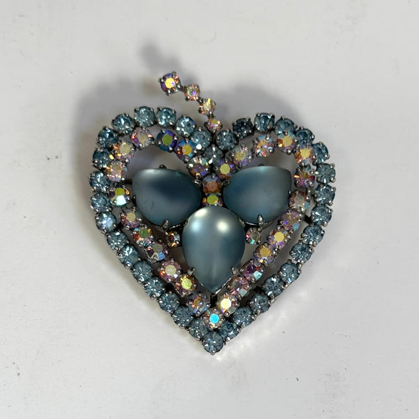 blue sparkly brooch from the 1950s on a white background