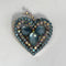 blue sparkly brooch from the 1950s on a white background