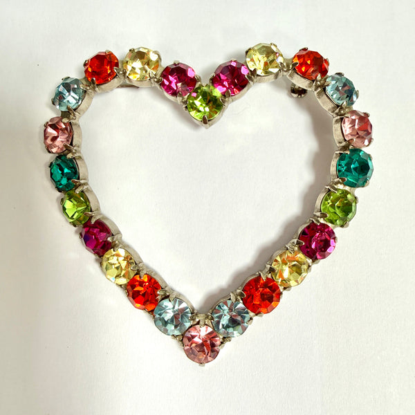 brightly coloured heart shaped brooch on  a white background vintage large statement