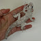 lizard brooch held in hand