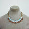 J crew vintage necklace with turquoise rectangular stones and pearshape deep red stones with a matte gold-plated chain