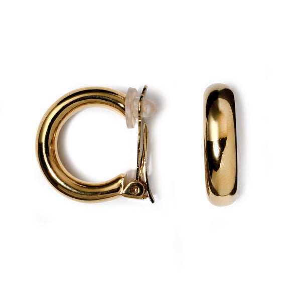 Gold hoop earring on a white background