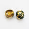 reverse of vintage Orena gold plate and green clip-on earrings