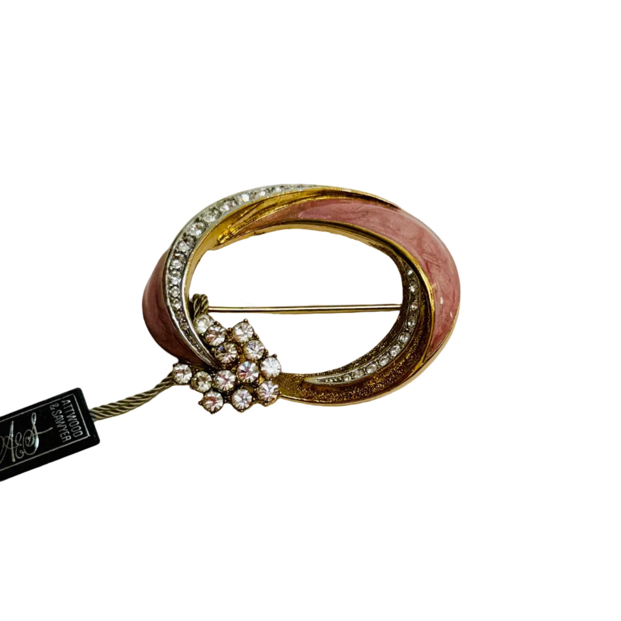 pink enamel brooch on a white background