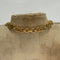 clasp of necklace on a bust