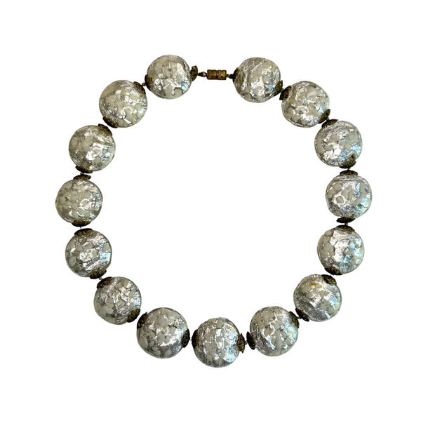 silver and white glass venetian beads on a grey background