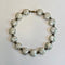 silver and white glass venetian beads on a grey background