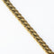 gold plated vintage curb link chain bracelet on white background