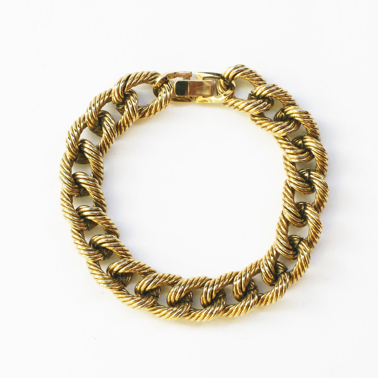 gold plated vintage curb link chain bracelet on white background
