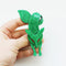 original lea stein green fox brooch with red eyes on white background in hand