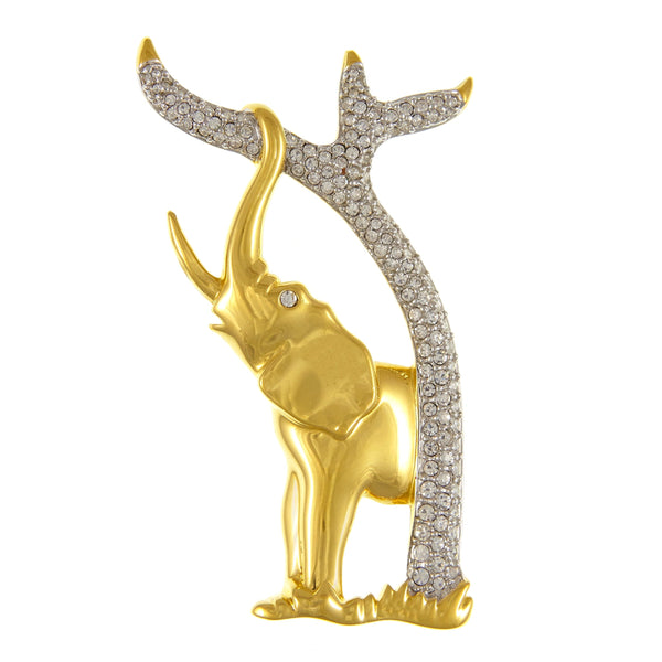 Lovely collectors piece made by Swarovski pre 1994 gold plated elephant brooch with a crystal encrusted tree trunk 